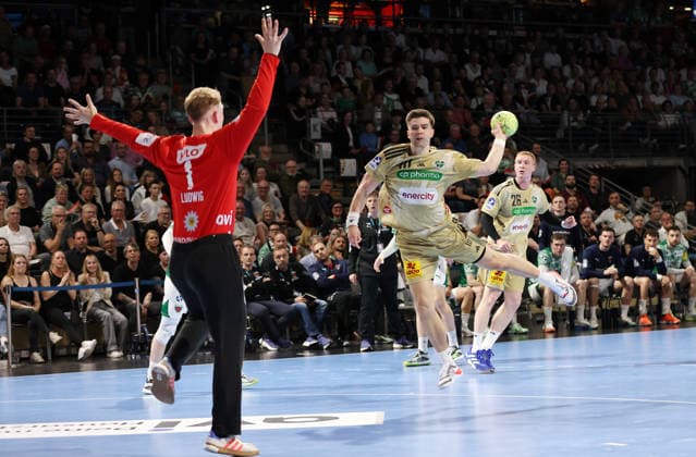 Renars Uscins scores a goal against goalkeeper Lasse Ludwig duel Game scene Action Sport Handball HBL Bundesliga Men 32 Matchday Season 2025 2026 21 05 2026 Füchse Berlin vs TSV Hannover Burgdorf