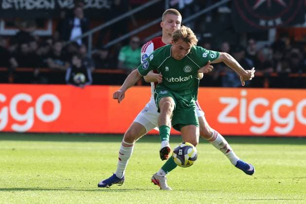 VOLENDAM lr Ajax player Anton Gaaei with FC Groningen player Jorg Schreuders during the Dutch Eredivisie match between Ajax and FC Groningen at Kras Stadium on 21 May 2026 in Volendam, the Netherlands Photo by DeFodi Images