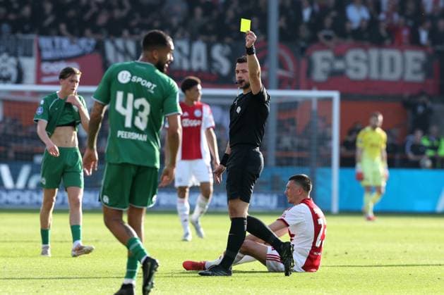 VOLENDAM lr Referee Marc Nagtegaal issues a yellow card during the Dutch Eredivisie match between Ajax and FC Groningen at Kras Stadium on May 21, 2026 in Volendam, the Netherlands Photo by DeFodi Images