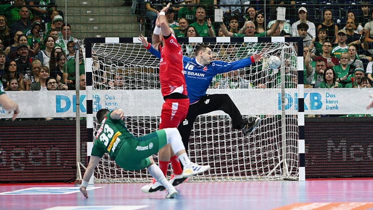 Handball Bundesliga, Season 2025 2026, Matchday 32, SC DHfK Leipzig vs MT Melsungen 21 05 2026 Goal Luka Rogan Circle Circle player DHfK Leipzig, back number 33 left vs Nebojsa Simic Goal Goalkeeper Melsungen, back number 16 right at Handball Bundesliga match DHfK Leipzig vs MT Melsungen 21 05 2026 Leipzig Saxony Germany QUARTERBACK Real Estate Arena Am Sportforum 2