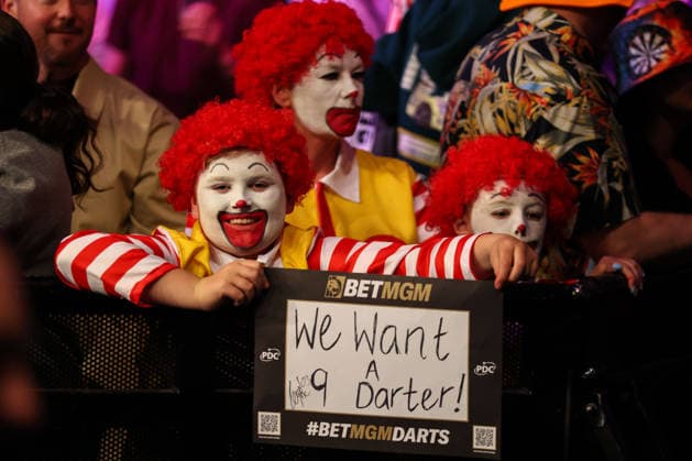 RECORD DATE NOT STATED 21st May 2026, Utilita Arena, Sheffield, Yorkshire, England; 2026 PDC Bet MGM Premier League Darts Night Sixteen; A fan dressed as a clown in the crowd holding up a & x2018;We want a 9 darter& x2019; sign AidanxHunter