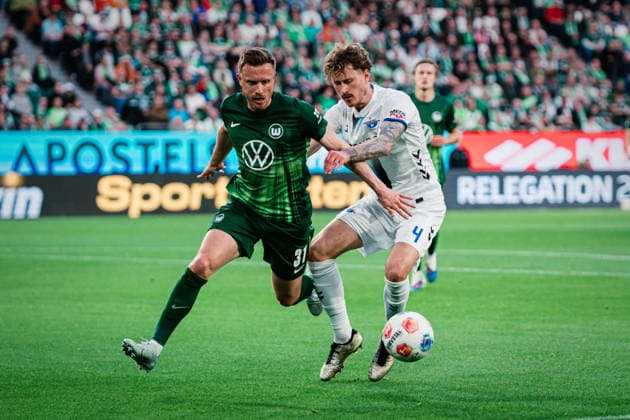 Relegation VfL Wolfsburg vs SC Paderborn, 21 05 2026 Calvin Marc Brackelmann SC Paderborn 07, 4 in duel with Yannick Gerhardt VfL Wolfsburg, 31 Soccer, 1 Bundesliga, Relegation, First leg VfL Wolfsburg vs SC Paderborn on 21 05 2026 at Volkswagen Arena, Wolfsburg DFL REGULATIONS PROHIBIT ANY USE OF PHOTOGRAPHS AS IMAGE SEQUENCES AND OR QUASI VIDEO Copyright: xBEAUTIFULxSPORTS Tonhäuserx