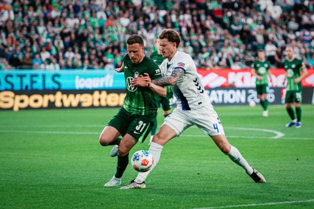 Relegation VfL Wolfsburg vs SC Paderborn, 21 05 2026 Calvin Marc Brackelmann SC Paderborn 07, 4 in duel with Yannick Gerhardt VfL Wolfsburg, 31 Soccer, 1 Bundesliga, Relegation, First leg VfL Wolfsburg vs SC Paderborn on 21 05 2026 at Volkswagen Arena, Wolfsburg DFL REGULATIONS PROHIBIT ANY USE OF PHOTOGRAPHS AS IMAGE SEQUENCES AND OR QUASI VIDEO Copyright: xBEAUTIFULxSPORTS Tonhäuserx
