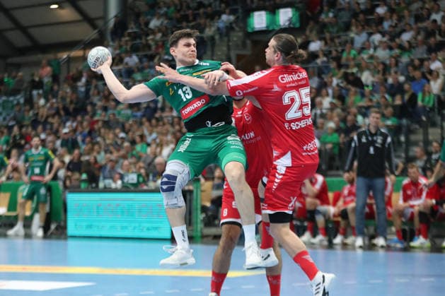 Handball DAIKIN HBL, SC DHfK Leipzig MT Melsungen 21 05 2026 Matej Klima 13, SC DHfK Leipzig is attacked by Olle Forsell Schefvert 25, MT Melsungen Handball, DAIKIN HBL, 1 Bundesliga, Season 2025 2026, 32 Matchday SC DHfK Leipzig vs MT Melsungen on 21 05 2026 at Quarterback Immobilien Arena Leipzig Copyright: xBEAUTIFULxSPORTS JanxKaeferx