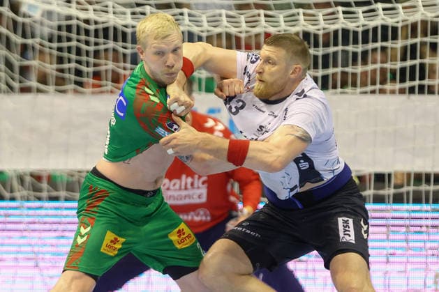 21 05 2026, xtgx, Handball, Daikin HBL, SC Magdeburg SG Flensburg Handewitt v l Magnus Saugstrup Magdeburg, 23 Blaz Blagotsinek Flensburg, 43 duel, duel, fight, tackle Magdeburg