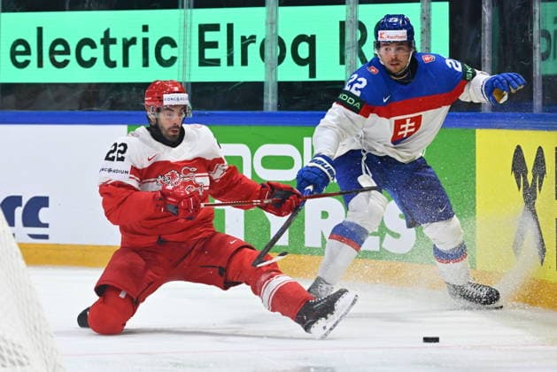 L-R Markus Lauridsen of Denmark, Kristian Pospisil of Slovakia in action during the 2026 IIHF World Championship, WM, Weltmeisterschaft Group B, match Slovakia vs Denmark, Fribourg, Switzerland, on May 21, 2026. (CTKxPhoto RadekxPetrasek) CTKPhotoP2026052109448  CTKPhotoP2026052109448