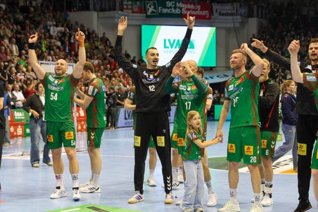 21 05 2026, xgox, Handball Daikin HBL SC Magdeburg SG Flensburg Handewitt emspor, v l Oscar Bergendahl Magdeburg, 54 , Matej Mandic Magdeburg, 12 , Celebrating the victory, cheering after the end of the game, celebrating the German championship, Magdeburg
