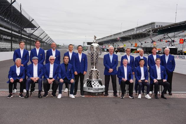 INDIANAPOLIS, IN - MAY 22: Former Indy 500 winners pose for a group photo at the yard of bricks with the Borg Warner Trophy and with Roger Penske the owner of the Indianapolis Motor Speedway who is back row far right during Miller Lite Carb Day for the 110th Running of the Indianapolis 500 on May 22, 2026, at the Indianapolis Motor Speedway in Indianapolis, Indiana. (Photo by Brian Spurlock Icon Sportswire) AUTO: MAY 22 NTT IndyCar, Indy Car, IRL, USA Series Miller Lite Carb Day EDITORIAL USE ONLY Icon2605225003