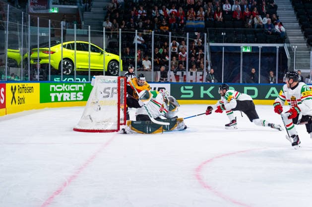 ZURICH, SWITZERLAND - MAY 22: Bence Balizs (Hungary, 1) trying to catch the puck from Leon Gawanke (Germany, 9) the 2:0 goal during the Preliminary Round - Group A Match 33 between Germany and Hungary at the IIHF Ice hockey, Eishockey World Championship, WM, Weltmeisterschaft 2026, Swiss Life Arena on May 22, 2026 in Zurich, Switzerland. Zurich Switzerland Copyright: xTimoxSteinx