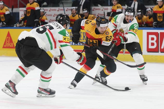 22 05 2026 Swiss Life Arena Zurich , SWITZERLAND, Mens Ice Hockey IIHF World Championship Zurich 2026 Group A GER HUN Parker Tuomie center,GER against Tamas Ortenszky left and Kristof Papp HUN