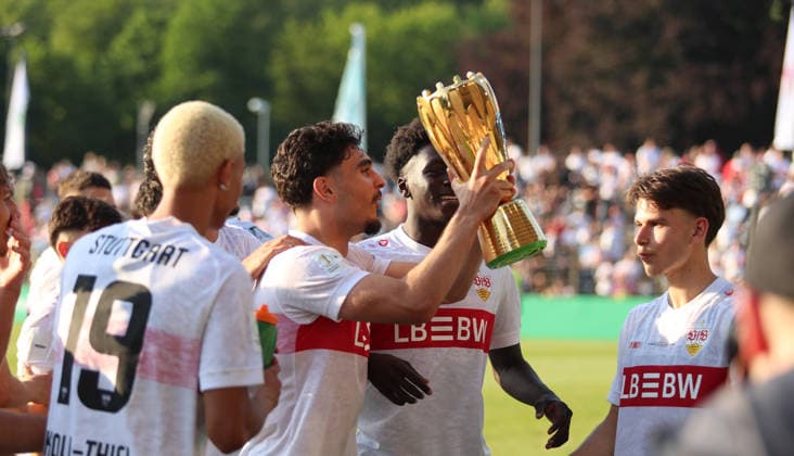 Berlin , Football final DFB Cup Juniors VfL Wolfsburg vs VfB Stuttgart , Emirhan Agzikara VfB with trophy , Cheering