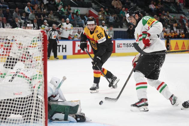 22 05 2026 Swiss Life Arena Zurich , SWITZERLAND, Mens Ice Hockey IIHF World Championship Zurich 2026 Group A GER HUN Marc Michaelis GER against Tamas Ortenszky HUN in front of goaltender Bence Balizs HUN