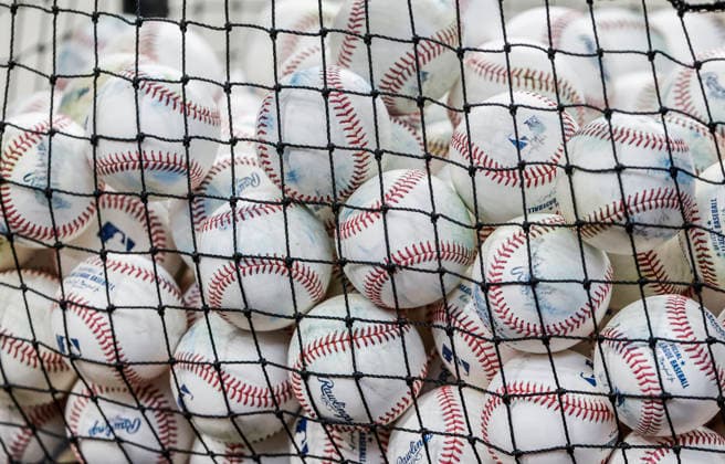 A basket of baseballs sits near the infield before the start of the MLB, Baseball Herren, USA game between the Los Angeles Dodgers and the Milwaukee Brewers at American Family Field in Milwaukee, Wisconsin on Friday, May 22, 2026.  MIL20260522804 TANNENxMAURY