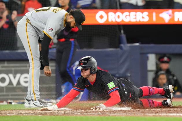 May 22, 2026, Toronto, On, CAN: Toronto Blue Jays Ernie Clement (22) slides home to score in front of Pittsburgh Pirates pitcher Dennis Santana (60) during eighth inning MLB, Baseball Herren, USA baseball action in Toronto on Friday, May 22, 2026. Ernie Clement; Dennis Santana  - ZUMAc35_ 20260522_zaf_c35_160 Copyright: xChrisxYoungx