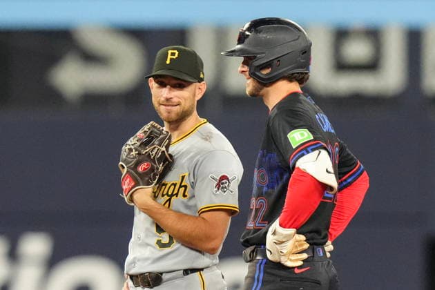 May 22, 2026, Toronto, On, CAN: Toronto Blue Jays Ernie Clement (22) shares a laugh with Pittsburgh Pirates second baseman Brandon Lowe (5) as umpires review a play during eighth inning MLB, Baseball Herren, USA baseball action in Toronto on Friday, May 22, 2026. Ernie Clement; Brandon Lowe  - ZUMAc35_ 20260522_zaf_c35_170 Copyright: xChrisxYoungx