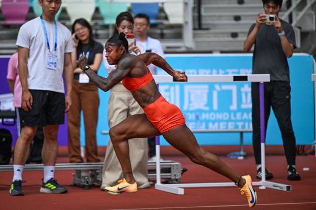 Wanda Diamond League Xiamen 2026 - Training Session XIAMEN, CHINA - MAY 22: American hurdles star Tonea Marshall practices her start during a track training session on the eve of the Xiamen Diamond League, the second leg of the 2026 Wanda Diamond League circuit, at the Xiamen Egret Stadium in Xiamen, Fujian province, China, on May 22, 2026. Xiamen China  Copyright: xArturxWidakx originalFilename:widak-wandadia260522_npttc.jpg