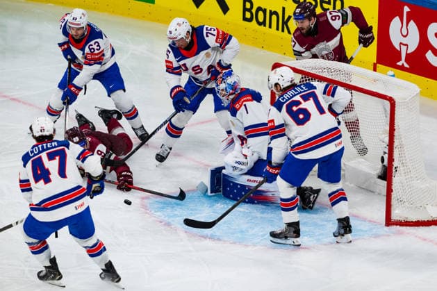 ZURICH, SWITZERLAND - MAY 23: USA Team stops Renars Krastenbergs (Latvia, 9) during the Preliminary Round - Group A Match 37 between Latvia and United States at the IIHF Ice hockey, Eishockey World Championship, WM, Weltmeisterschaft 2026, Swiss Life Arena on May 23, 2026 in Zurich, Switzerland. Zurich Switzerland Copyright: xTimoxSteinx