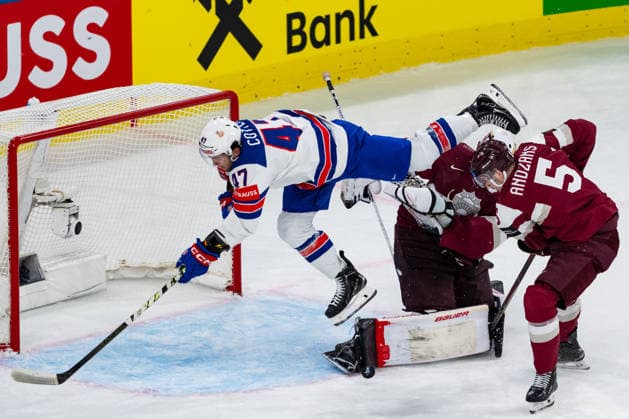 ZURICH, SWITZERLAND - MAY 23: Paul Cotter (United States, 47) flying over Kristers Gudlevskis (Latvia, 50) during the Preliminary Round - Group A Match 37 between Latvia and United States at the IIHF Ice hockey, Eishockey World Championship, WM, Weltmeisterschaft 2026, Swiss Life Arena on May 23, 2026 in Zurich, Switzerland. Zurich Switzerland Copyright: xTimoxSteinx