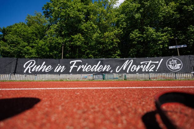 Hansa fans have attached a black mourning banner to the empty guest block with the text Rest in peace, Moritz GER, FC Hansa Rostock vs SV Pastow, Football, Men, Lübzer Pils Landespokal, Final, Season 2025 2026, 23 05 2026 Greifswald Volksstadion Mecklenburg Vorpommern Germany