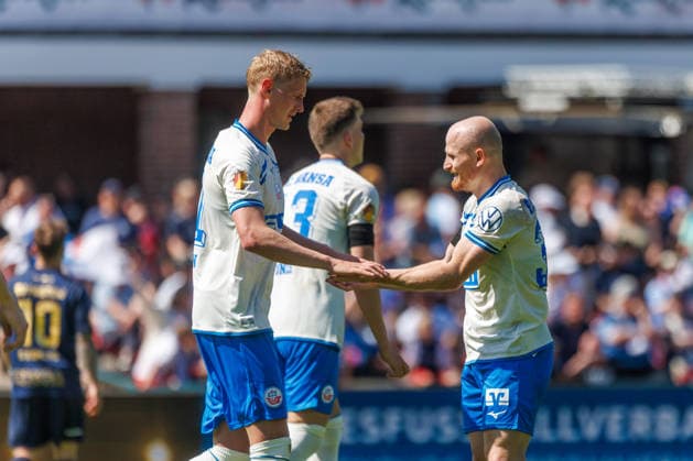 right goal scorer Maximilian Krauß Rostock to 3 0 cheers and is happy about his goal with left Emil Frost Holten Rostock GER, FC Hansa Rostock vs SV Pastow, soccer, men, Lübzer Pils Landespokal, final, season 2025 2026, 23 05 2026 Greifswald Volksstadion Mecklenburg Vorpommern Germany