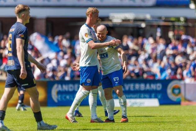 right goal scorer Maximilian Krauß Rostock to 3 0 cheers and is happy about his goal with left Emil Frost Holten Rostock GER, FC Hansa Rostock vs SV Pastow, soccer, men, Lübzer Pils Landespokal, final, season 2025 2026, 23 05 2026 Greifswald Volksstadion Mecklenburg Vorpommern Germany