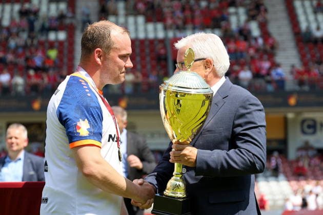 11 Andy Hebler Krieschow is presented with the Brandenburg State Cup Football State Cup Brandenburg 2025 2026 Final FC Energie Cottbus VfB Krieschow 1921