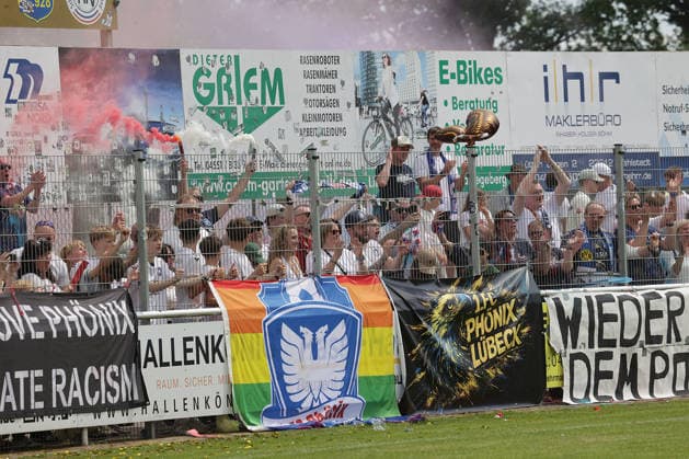 Fans of Phoenix Luebeck celebrate the cup victory Football, Men, Season2025 2026, State Cup Final Schleswig Holstein, Joda Park Todesfelde, SV Todesfelde vs Phoenix Luebeck, 1 4 DFL REGULATIONS PROHIBIT ANY USE OF PHOTOGRAPHS AS IMAGE SEQUENCES AND OR QUASI VIDEO