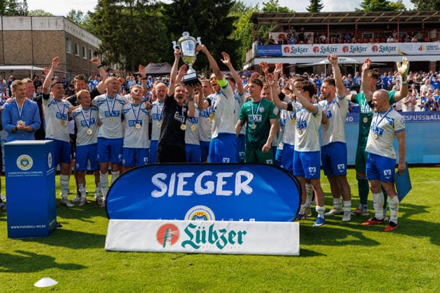 on the left, caretaker Andreas Thiem Rostock and Franz Pfanne Rostock with the winners trophy GER, FC Hansa Rostock vs SV Pastow, soccer, men, Lübzer Pils Landespokal, final, season 2025 2026, 23 05 2026 Greifswald Volksstadion Mecklenburg Vorpommern Germany