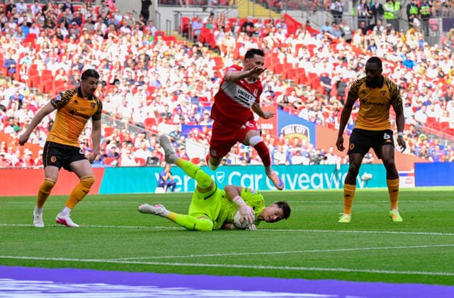 Hull City v Middlesbrough, London, UK - 23 May 2026 Alan Browne of Middlesbrough leaps over Ivor Pandur goalkeeper of Hull City during the Sky Bet Championship Playoff Final match between Hull City and Middlesbrough on 23 May 2026 at Wembley Stadium, London. - London Wembley Stadium London GBR Copyright: xAlanxStanford PPAUKx PPA-277001
