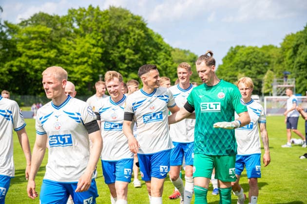 Andreas Vogelsammer, Kenan Fatkic and goalkeeper Philipp Klewin all FCH on the way to the award ceremony GER, Football, State Cup, Lüpzer Pils Cup, Final, SV Pastow FC Hansa Rostock