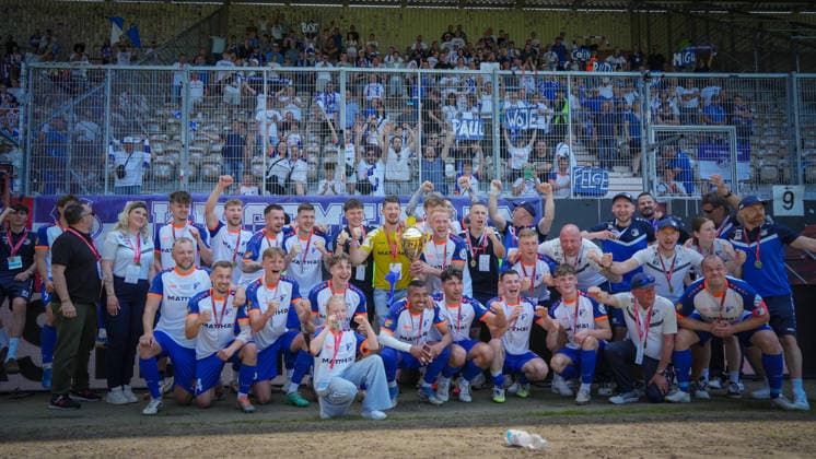 Soccer, Men, Season 2025 2026, Brandenburg State Cup, Final, Final day of the amateurs, FC Energie Cottbus vs VfB 1921 Krieschow, Saturday 23 05 2026, LEAG Energie Stadion Cottbus, In the picture The VfB Krieschow team cheers in front of the guest block with the fans traveling with them Brandenburg Germany