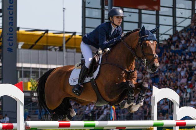 179 Lillie Keenan on Kick On (USA) during the TSCHIO 2026 (CHIO 2026) - 2nd Qualifier Rolex Grand Prix - CSI5* - Jumping competition with jump-off at the Allianz Park in Aachen, Germany  Copyright: xMartinxPitschx xSPPx Sportspressphoto_152455