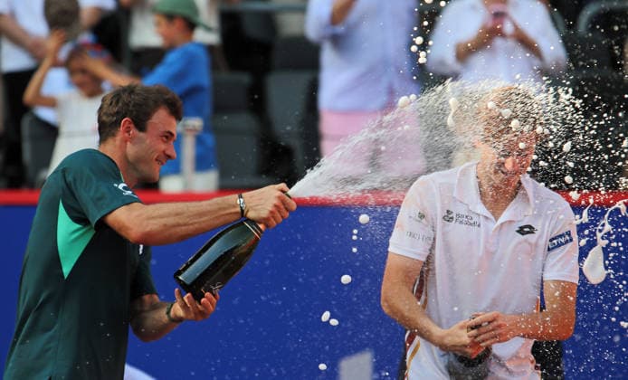 Bitpanda Hamburg Open, ATP champagne shower by Tommy Paul USA for tournament winner Ignacio Buse from Peru
