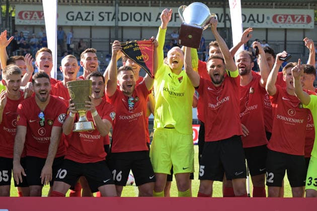 Captain Volkan Celiktas SG Sonnenhof Grossaspach, 05 lifted the championship trophy of the Regionalliga Süd West and Mert Tasdelen SG Sonnenhof Grossaspach, 10 the DB Regio wfv Verbandspokal Wuettenberg and Marius Kunde SG Sonnenhof Grossaspach, 16 the cup pennant in the sky under the television tower of the Stuttgart Gazi Stadium on the Waldau SV Stuttgarter Kickers vs SG Sonnenhof Grossaspach, football, men, DB Regio wfv cup final, season 2025 2026, 23 05 2026 SV Stuttgarter Kickers vs SG Sonnenhof Grossaspach, football, men, DB Regio wfv cup final, season 2025 2026, 23 05 2026 Stuttgart Copyright: xEibner-Pressefoto TobiasxBaurx EP_TBR