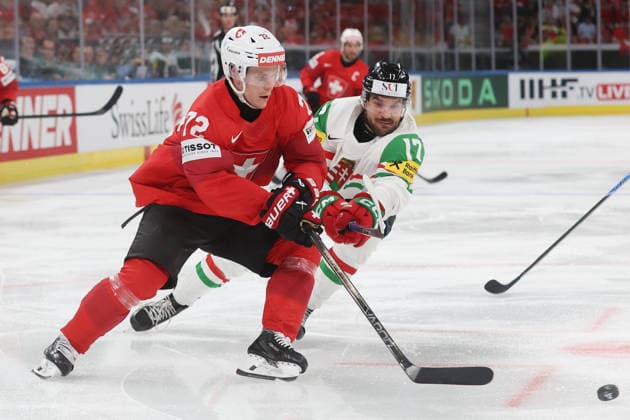 23 05 2026 Swiss Life Arena Zurich , SWITZERLAND, Mens Ice Hockey IIHF World Championship Zurich 2026 Group A SUI HUN Dominik Egli li,SUI against Roland Kiss HUN