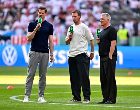 23 05 2026, Football DFB Pokal 2025 2026, Final, FC Bayern Munich VfB Stuttgart, at Olympiastadion Berlin Coach Julian Nagelsmann Germany during interview f l Alexander Schlüter Germany , Coach Julian Nagelsmann Germany and TV expert Bastian Schweinsteiger Germany DFL and DFB regulations prohibit any use of photographs as image sequences and or quasi video