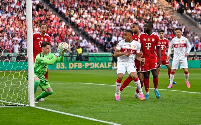 23 05 2026, Football DFB Pokal 2025 2026, Final, FC Bayern Munich VfB Stuttgart, at Olympiastadion Berlin Goalkeeper Jonas Urbig FC Bayern Munich holds the ball DFL and DFB regulations prohibit any use of photographs as image sequences and or quasi video