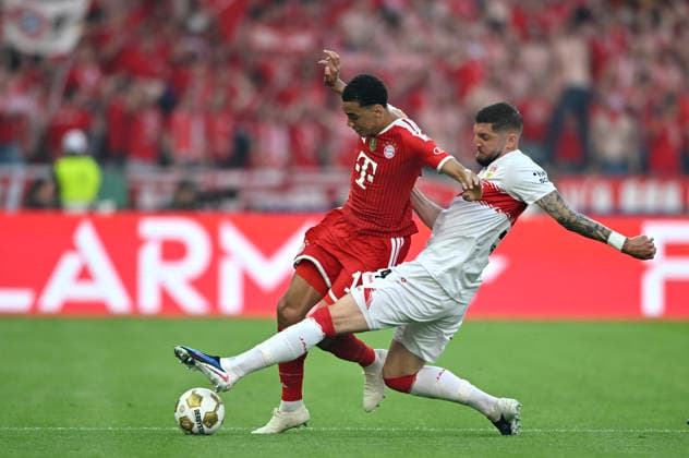 Jamal Musiala FC Bayern Muenchen FCB 10 vs Jeff Chabot VfB Stuttgart 24 83 DFB Pokalfinale FC Bayern Muenchen FCB vs VFB Stuttgart Olympiastadion Berlin 23 05 2026 DFL REGULATIONS PROHIBIT ANY USE OF PHOTOGRAPHS AS IMAGE SEQUENCES AND OR QUASI VIDEO 83 DFB Pokalfinale FC Bayern Muenchen FCB vs VFB Stuttgart