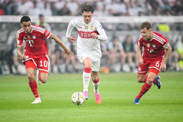 Jamal Musiala FC Bayern München , Angelo Stiller VfB Stuttgart and Joshua Kimmich FC Bayern München battle for the ball during the DFB Cup Final 2026 match between FC Bayern München and VfB Stuttgart at Olympiastadion on May 23, 2026 in Berlin, Germany Photo by Harry Langer DeFodi Images