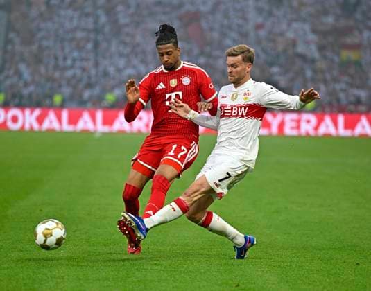23 05 2026, Football DFB Pokal 2025 2026, Final, FC Bayern Munich VfB Stuttgart, at Olympiastadion Berlin v l Michael Olise FC Bayern Munich v Maximilian Mittelstädt Stuttgart DFL and DFB regulations prohibit any use of photographs as image sequences and or quasi video