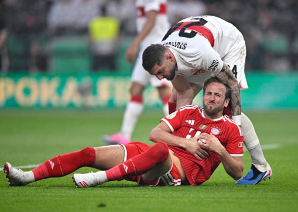 Jeff Chabot VfB Stuttgart 24 takes care of Harry Kane FC Bayern Muenchen FCB 09 injured Injury 83 DFB Pokal Final FC Bayern Muenchen FCB vs VFB Stuttgart Olympiastadion Berlin 23 05 2026 DFL REGULATIONS PROHIBIT ANY USE OF PHOTOGRAPHS AS IMAGE SEQUENCES AND OR QUASI VIDEO 83 DFB Pokal Final FC Bayern Muenchen FCB vs VFB Stuttgart