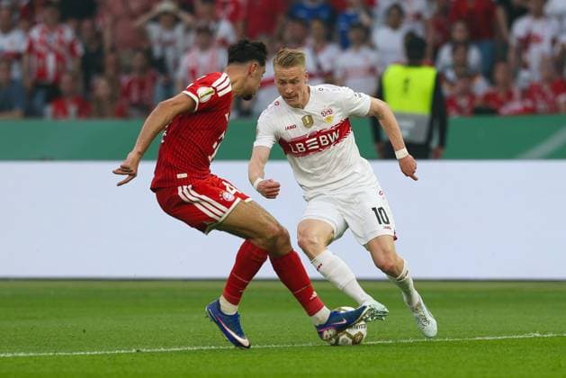 in duel, action, with Alexandar Pavlovic 45 FC Bayern Muenchen , Chris Fuehrlich 10 VfB Stuttgart , FC Bayern Muenchen vs VfB Stuttgart, Football, 83 DFB Pokalfinale, 23 05 2026 DFL DFB regulations prohibit any use of photographs as image sequences and or quasi video Berlin Berlin Germany Copyright: xkolbert-press ChristianxKolbertx