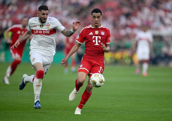Soccer DFB Cup Final 2025 2026 in Berlin FC Bayern Muenchen VfB Stuttgart 23 05 2026 Jeff Chabot left, VfB Stuttgart vs Jamal Musiala right, FC Bayern Muenchen