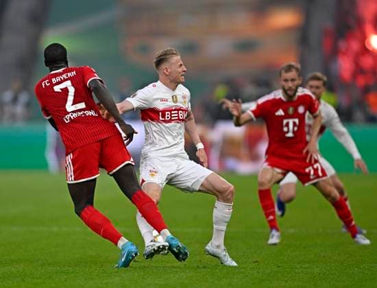 23 05 2026, Football DFB Pokal 2025 2026, Final, FC Bayern Munich VfB Stuttgart, at Olympiastadion Berlin Chris Führich Stuttgart fouls Dayot Upamecano FC Bayern Munich DFL and DFB regulations prohibit any use of photographs as image sequences and or quasi video