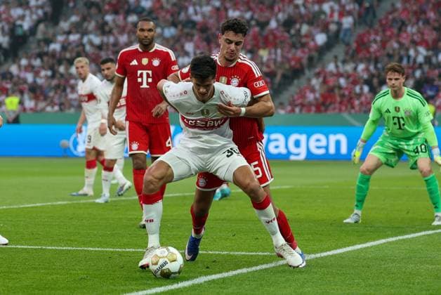 in duel, action, with Chema Andres 30 VfB Stuttgart , Alexandar Pavlovic 45 FC Bayern Muenchen , FC Bayern Muenchen vs VfB Stuttgart, Football, 83 DFB Pokalfinale, 23 05 2026 DFL DFB regulations prohibit any use of photographs as image sequences and or quasi video Berlin Berlin Germany Copyright: xkolbert-press ChristianxKolbertx