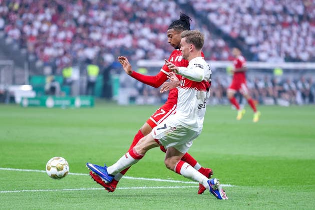 23 05 2026, Football, 83 DFB Pokal Final,, FC Bayern München VfB Stuttgart, Olympioastadion Berlin, Saison 2025 2026 Michael Olise FC Bayern Muenchen 17 in duel against Chris Führich VfB Stuttgart 10 DFB regulations prohibit any use of photographs as image sequences and or quasi video Berlin Germany
