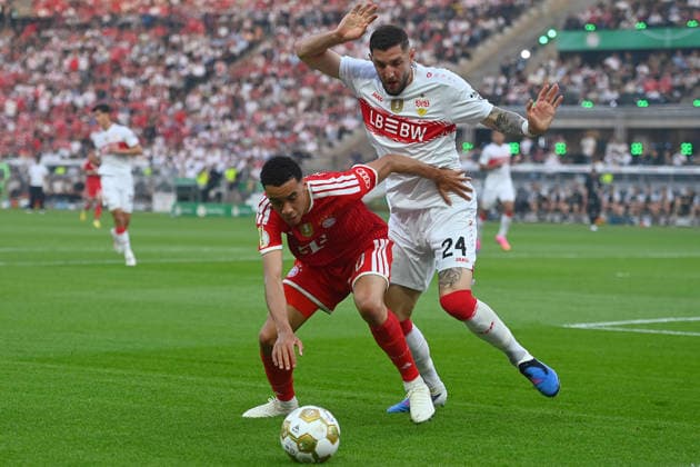 Jeff CHABOT VFB Stuttgart , action,duel against Jamal MUSIALA Bayern Muenchen Fussball 83 DFB Pokal Final 2026 FC Bayern Muenchen VfB Stuttgart on 23 05 2026, Olympiastadion in Berlin DFL DFB regulations prohibit any use of photographs as image sequences and or quasi video