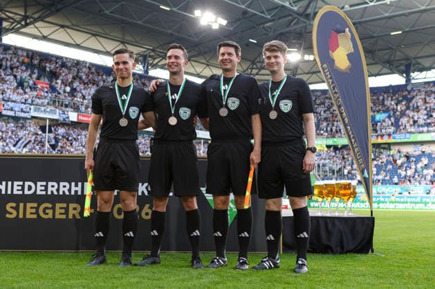 23 05 2026, GER, Football, Men, Niederrheinpokal Final, Season 2025 2026, SC St Tönis MSV Duisburg Assistant referee Kristijan Rajkovski, referee Jan Peter Weßels, assistant referee Marco Lechtenberg and fourth official Felix May with the medal after the Niederrheinpokal Duisburg schauinsland reisen Arena Nordrhein Westfalen Germany Copyright: xAdrianxSchlüterx