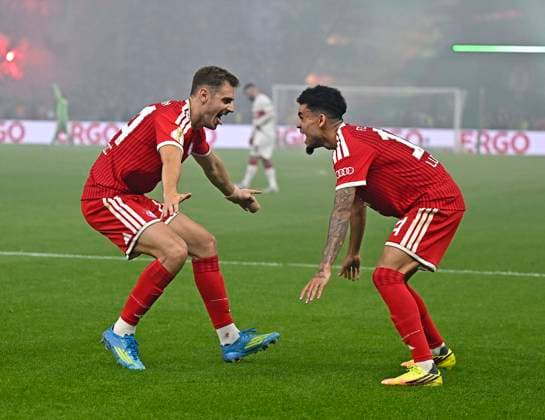 23 05 2026, Football DFB Pokal 2025 2026, Final, FC Bayern Munich VfB Stuttgart, in the Olympiastadion Berlin v l Josip Stanisic Bayern Munich and Luis Diaz FC Bayern Munich cheer DFL and DFB regulations prohibit any use of photographs as image sequences and or quasi video