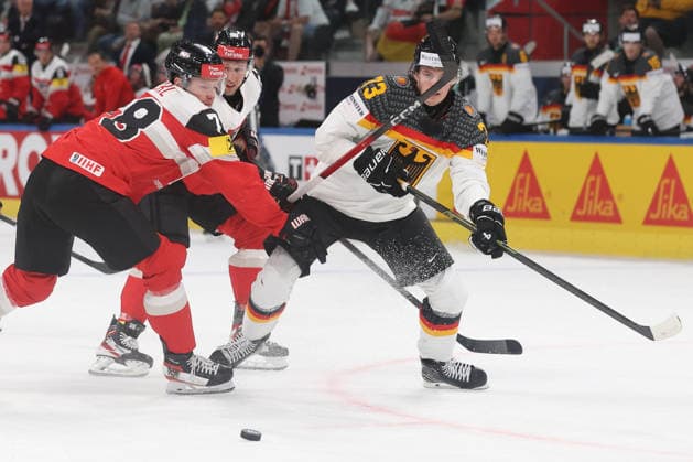 23 05 2026 Swiss Life Arena Zuerich , SWITZERLAND, Men Ice Hockey IIHF World Championship Zurich 2026 Group A AUT GER Thimo Nickl li,AUT against Lukas Reichel GER